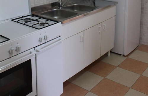 Specchiolla Apartment | Well maintained apartment under palm trees with large terrace in Lido Spechiolla