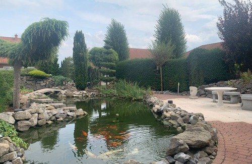 Rinteln House | Wesergarten vacation home with fireplace, large garden and well-kept fish pond