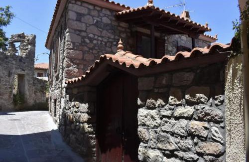 Eresos-Antissa House | wood and stone in the path of lava