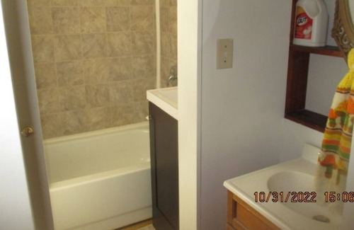 Townsend House | Wooded acre, attached garage plus attached lean-to.