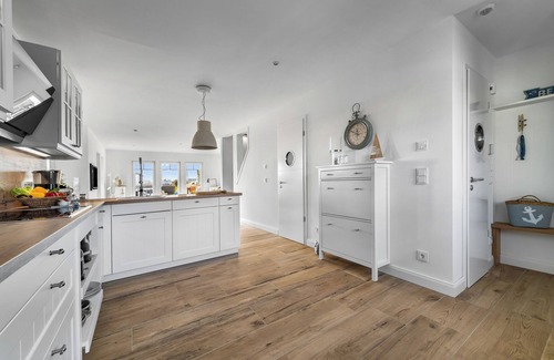 Olpenitz House | Wooden holiday home "Bootshaus" with sauna, bathing jetty and south-facing terrace with Baltic Sea view