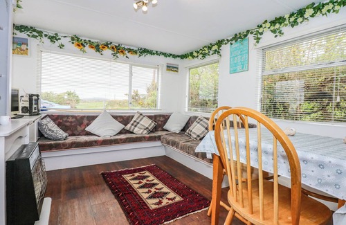 Rhyd-y-clafdy Cottage | WOODLAND CARAVAN, pet friendly, with a garden in Y Ffor