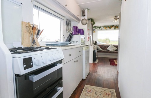 Rhyd-y-clafdy Cottage | WOODLAND CARAVAN, pet friendly, with a garden in Y Ffor