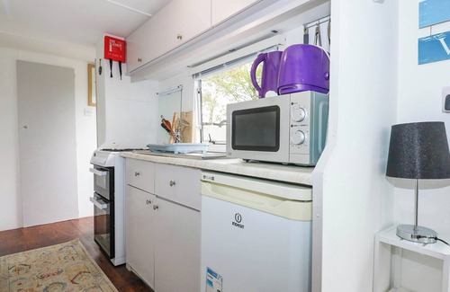 Rhyd-y-clafdy Cottage | WOODLAND CARAVAN, pet friendly, with a garden in Y Ffor