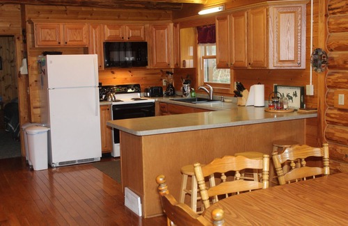 Pickerel Cabin | Year-round cabin, wooded riverfront on Lily River, WiFi, Central A/C, ATV Trails