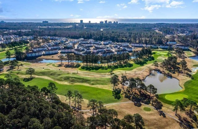 1st Floor Unit W/Patio, Golf Course and Pool View, less than 10 Min to the Beach