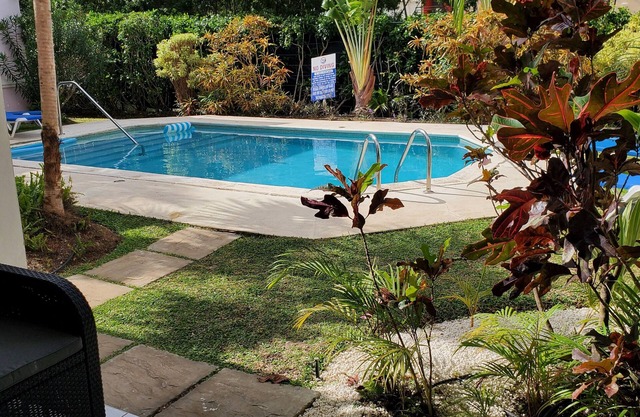 2 mins to beach! Family sized condo with a pool. Super close to dining and fun!