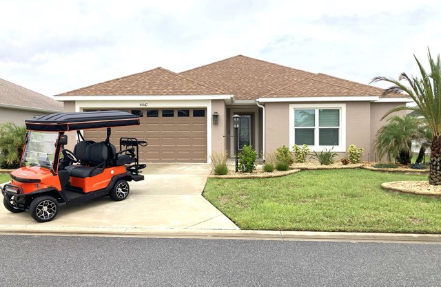3 BEDROOM 2 BATH DESIGNER in THE VILLAGES with 2-CAR Garage & ELECTRIC GOLF CART
