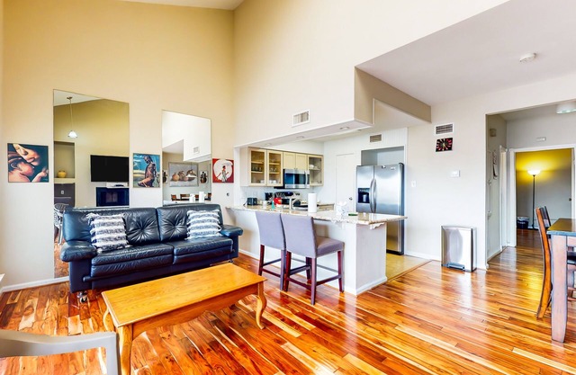 3rd-floor condo with water views, on-site pool, & private balcony