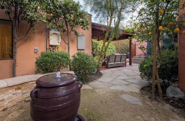 5-Star Urban Oasis with a Gourmet Kitchen, Tranquil Fountains and Fruit Trees