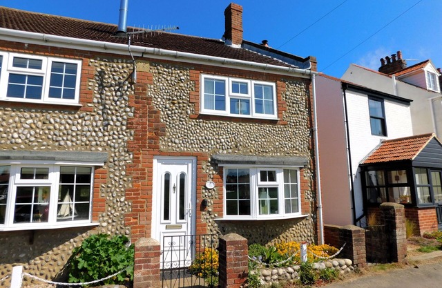 73 Beeston Common - traditional brick and flint end terrace cottage has been renovated.