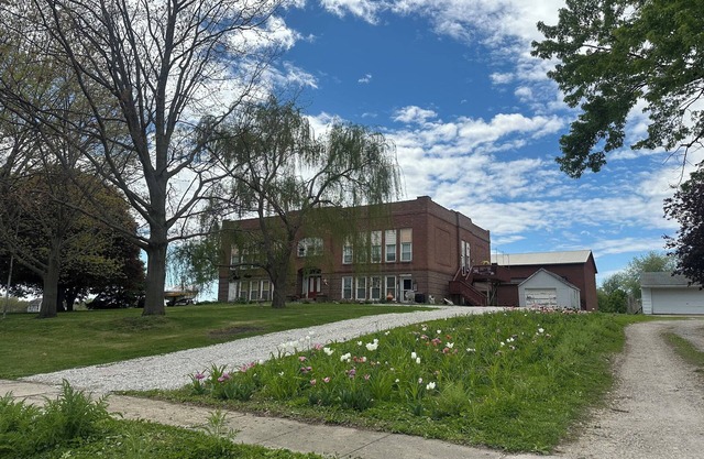 A Class-y & spacious 1500 square foot retreat in a century old brick schoolhouse