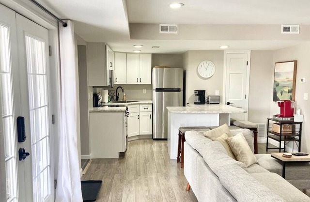 A clean luxury suite on a lakeside view with city amenities within 5 minutes.