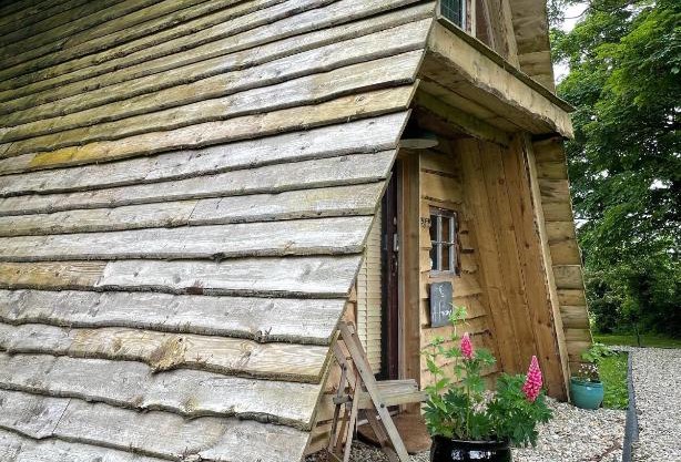 A Frame Cabin with Forest Views on an Island