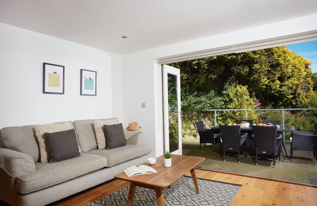 A stunning ground floor apartment with a large outdoor terrace and sea views.