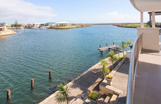 A two-story luxury home on the Port Geographe Canals