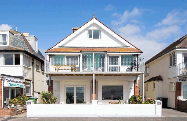 Absolute Beachfront with Decked Garden Oasis and Views