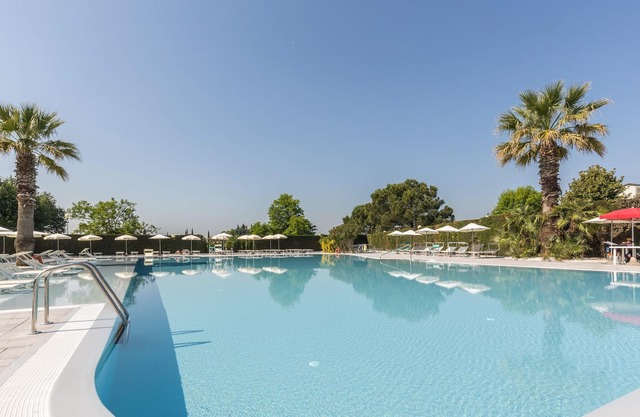 Apartment "BELLA ITALIA" in Lazise on Lake Garda with Pool & Sports Area, Private Sun Terrace with Barbecue, Fenced Lawn & Private Parking