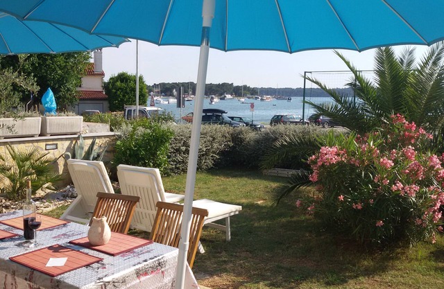 Apartment by the sea with Mediterranean garden and barbecue area