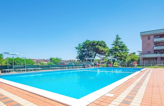 Apartment in a complex with communal pool, near the beach.