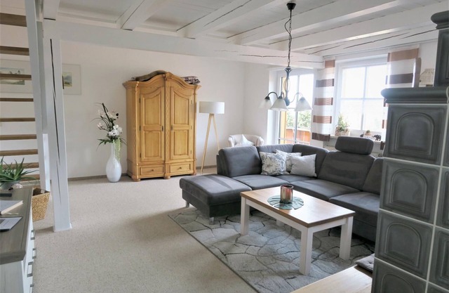 Apartment with tiled stove and covered carport