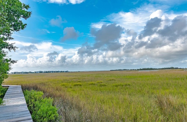 As you enter, the Bald Head Creek and marsh vistas-through the walls of windows-catch your eye.