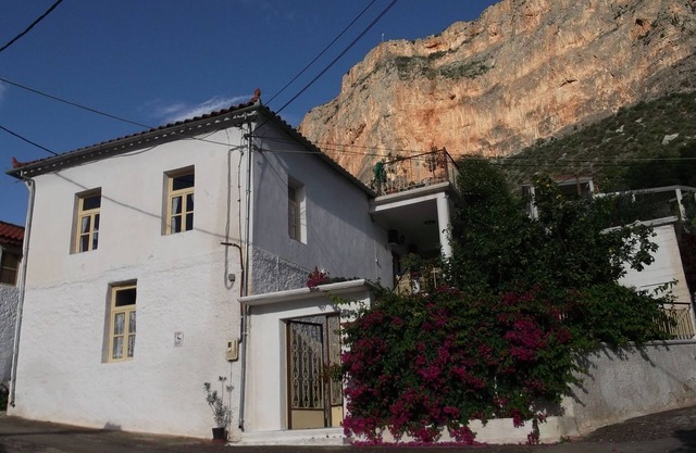 At the foot of the red cliff. Leonidio. Greece.