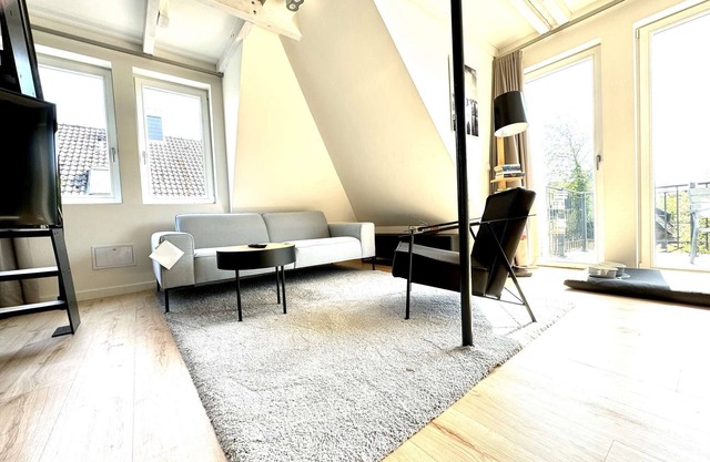 Attic with great balcony for 3 persons. Sauna, pool, garden.