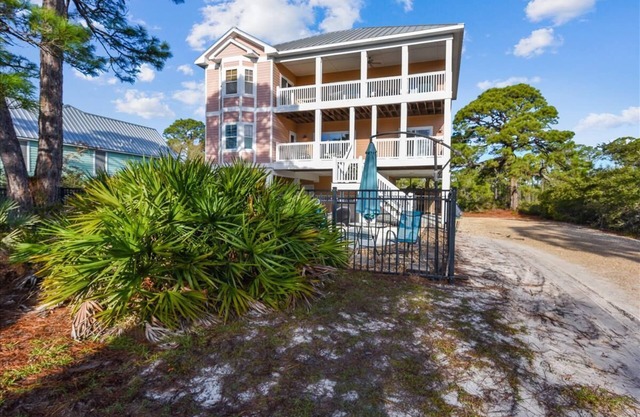 ATTITUDE ADJUSTER IS THE PERFECT FAMILY GETAWAY! Tucked away on over an acre of land.