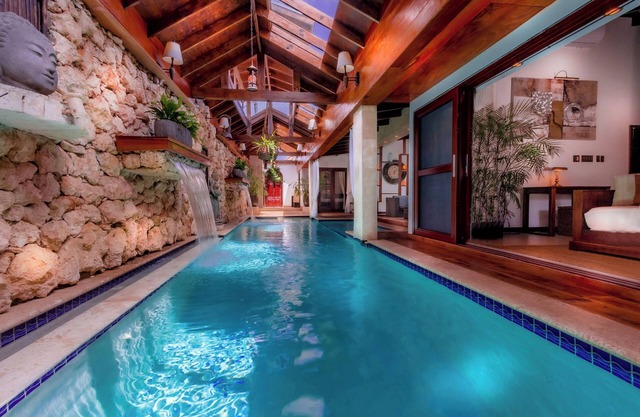 Bali-style villa: indoor and outdoor pool, cinema, cave, yoga, gym & beach court