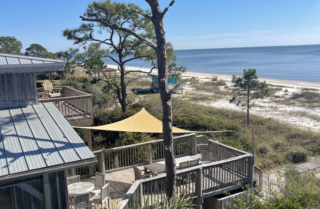 BEACH FRONT to BAY with boatdock, swimming pool, pickleball courts and kayaks.