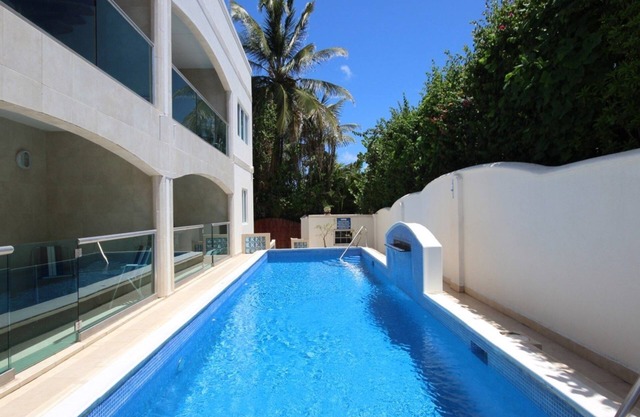 Beautiful, airy 3 bedroom second-floor unit with views of the ocean and pool.