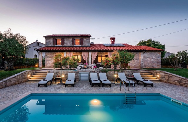 Beautiful Istrian stone house, with panoramic sea view and beautiful garden.