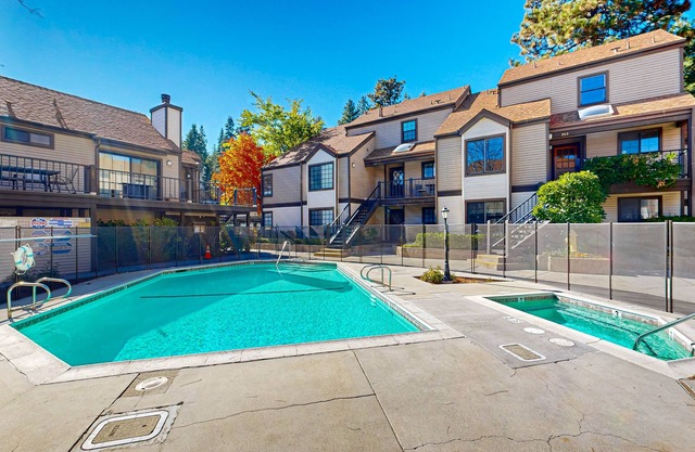 Beautiful lake-view condo w/shared pool and hot tub walk to restaurants & shops