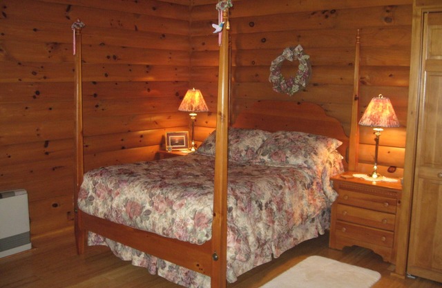Beautiful log sided, on Owasco Lake w/private beach, entrance and parking.