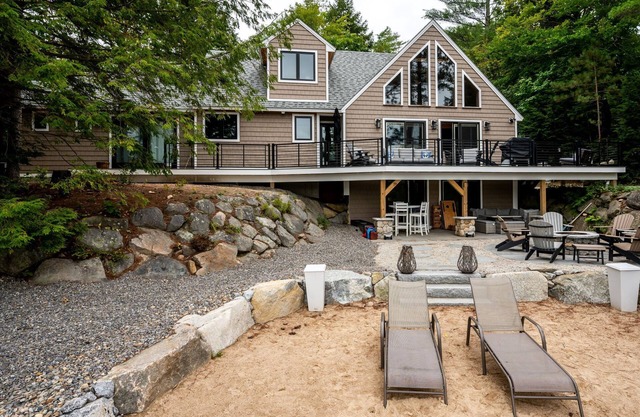 Beautiful new home sleeps 9 with perched sandy beach and steps into the water