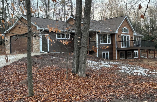 Beautiful new home nestled on 5.5 acres of Lake Michigan sand dunes