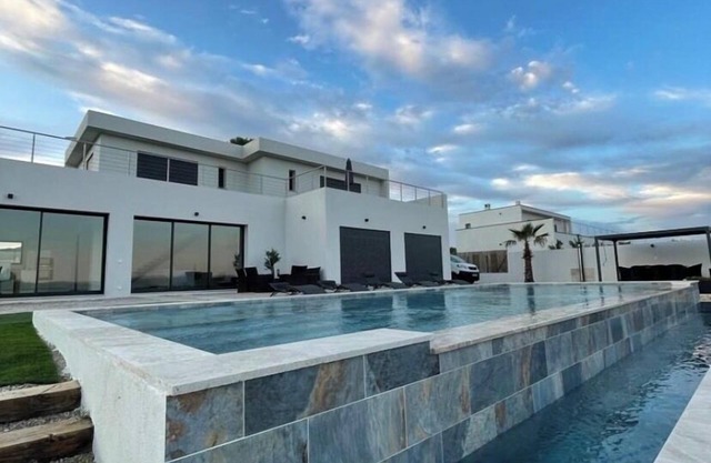 Beautiful new housse with splendid view and big pool.