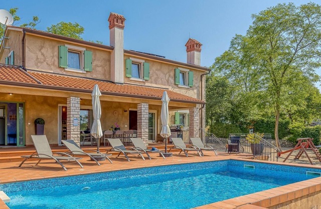 Beautiful villa with swimming pool surrounded by a natural fence
