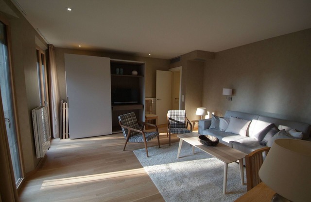 Beautifully furnished luxury four bedroom apartment with a small garden and pool