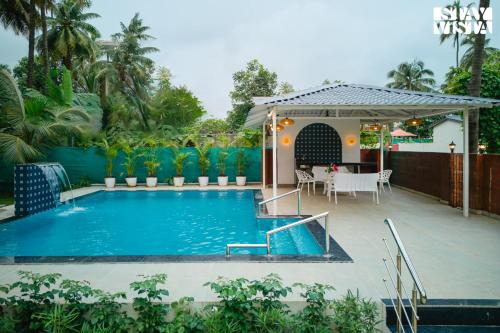 Belas Palmeiras by VEO - Part of StayVista with Pool & Bonfire