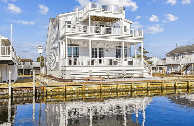 BOOK BEFORE JUL 15 TO SAVE 10% OFF OPEN AUG WEEKS! *Rates listed reflect discount Activities included up to $300 FREE PER WEEK! NEW LISTING 2024! BRAND NEW CONSTRUCTION! Exceptional waterfront custom vacation home is located on a canal in famil