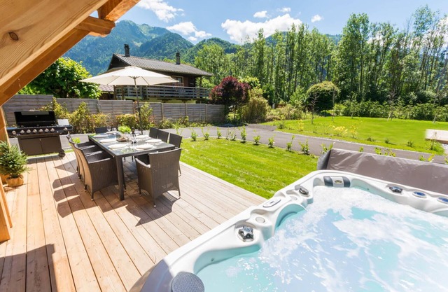 Brand new 4 bed/5 bath detached chalet w/hot tub, terrace and garden.