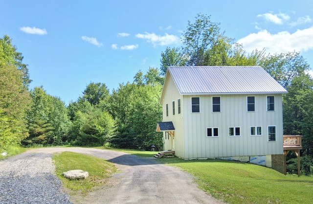 Brand new family home nestled in the woods close to Waterbury, Stowe, and Sugarbush with a hot tub