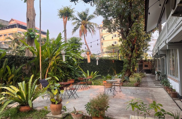Bright and Cozy Bedroom with AC in a Stylish Thai House, Primary Location.