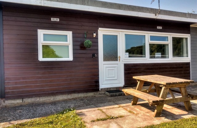 Buck's Cross Bideford Bay Devon chalet has own patio on maintained holiday park.