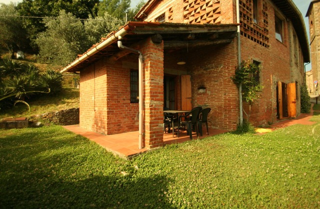 Centuries old farmhouse on the hills of Lucca set amongst vineyards and olive groves