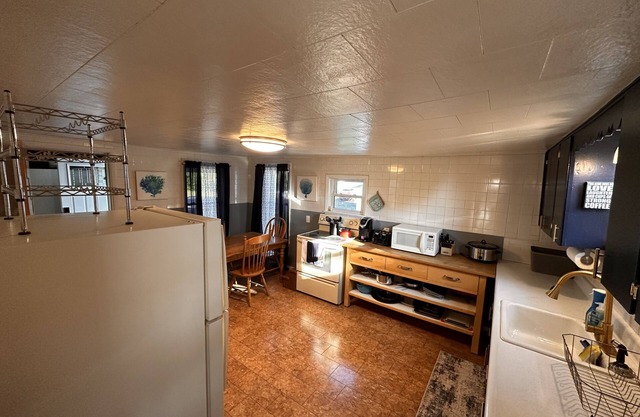 Charming New England Cape just feet from Snowmobile and ATV Trails!