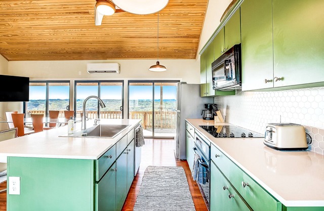 Charming, river view home with a furnished deck, central AC, & full kitchen