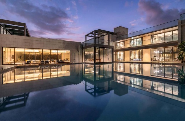 Colossus by StayVista - Riverside luxury villa in Khalapur with a Spacious pool, Sauna, Private theater, Gazebo & Lawn